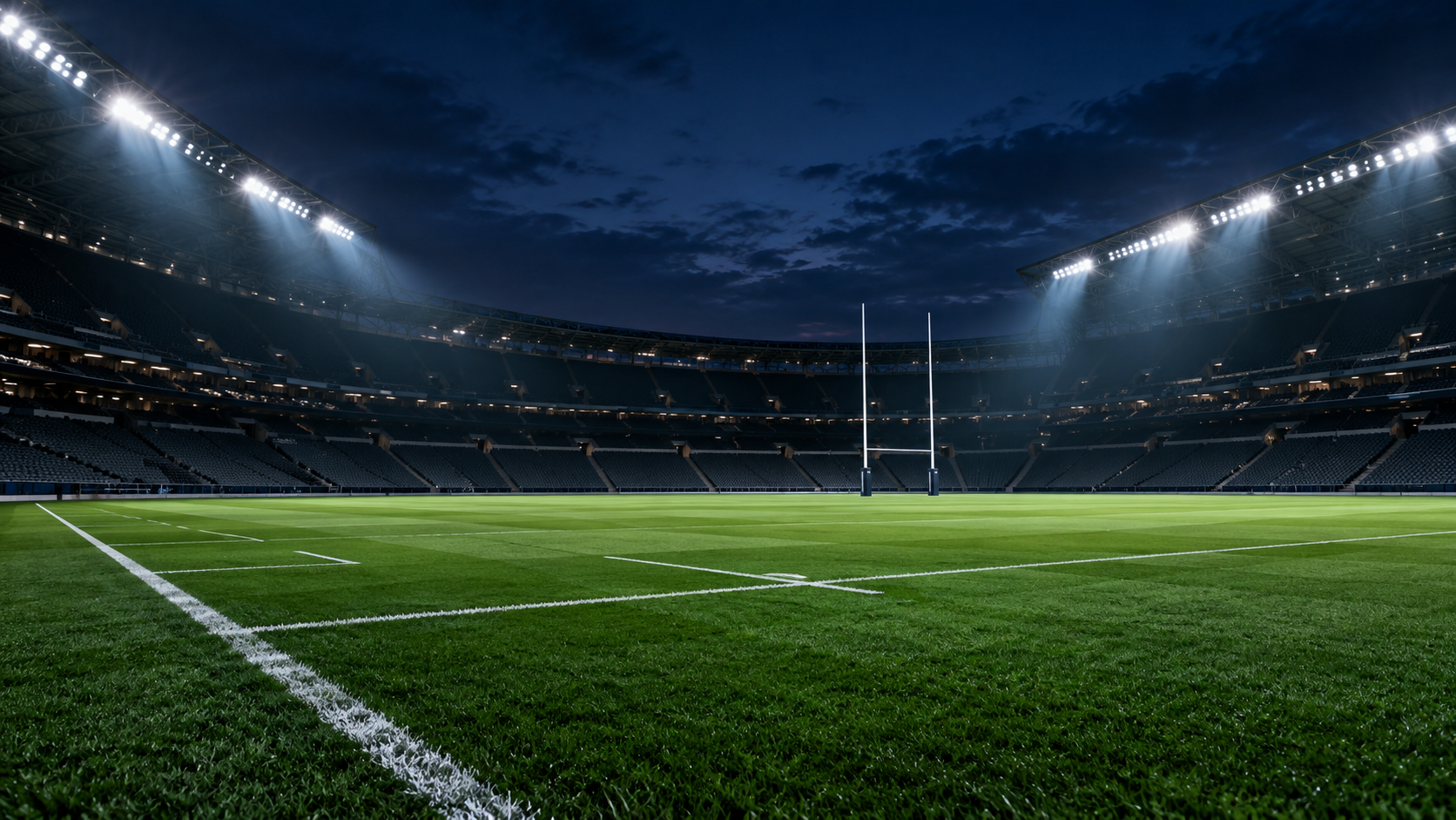 Floodlights illuminating a rugby stadium at blue hour